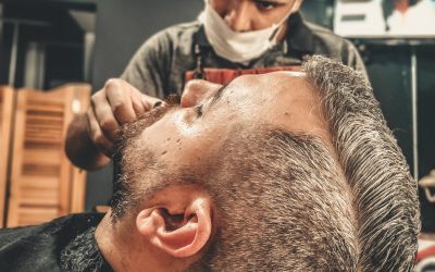 man-having-a-haircut-1813346